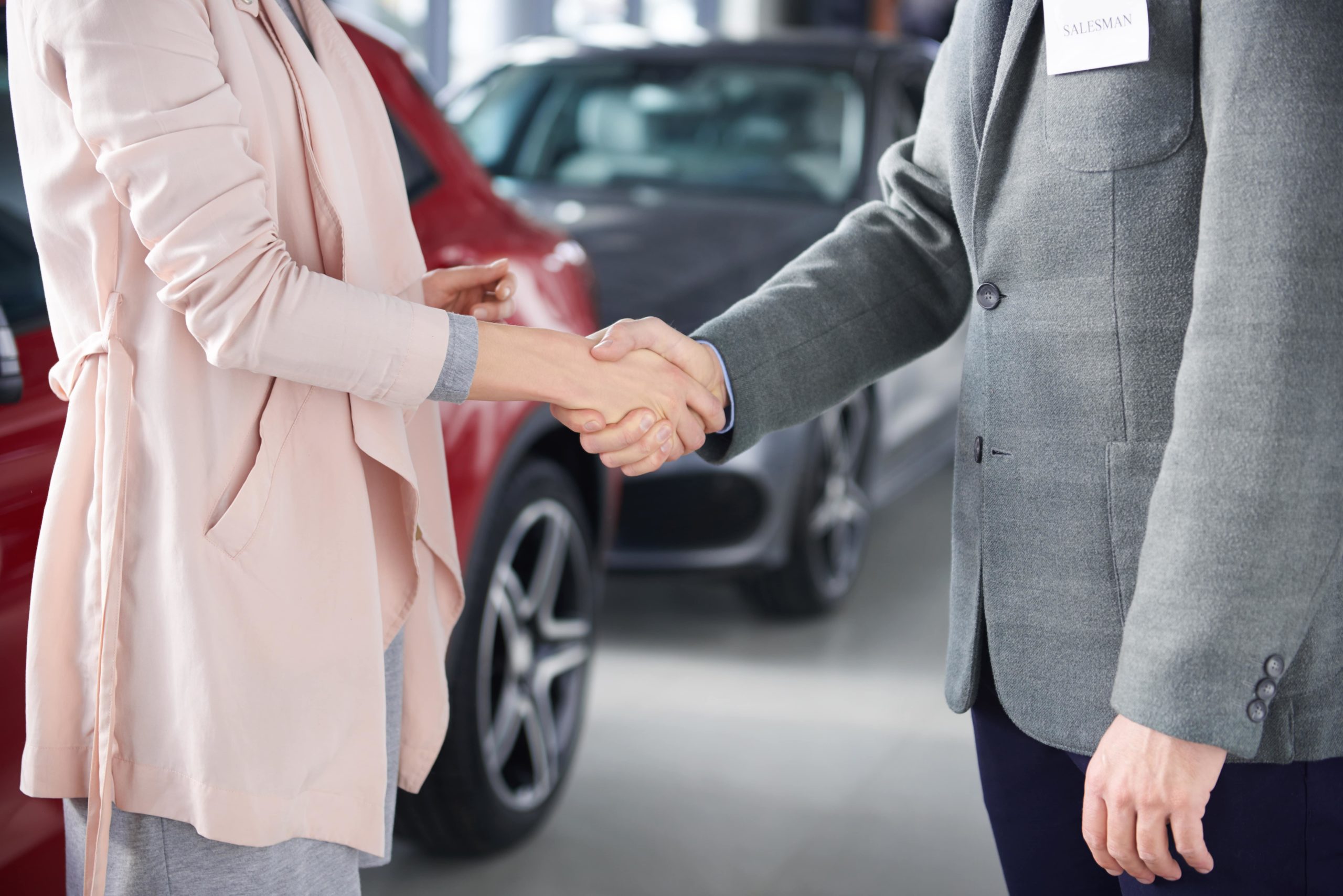 close up of handshake salesman and woman LFA44LA min scaled